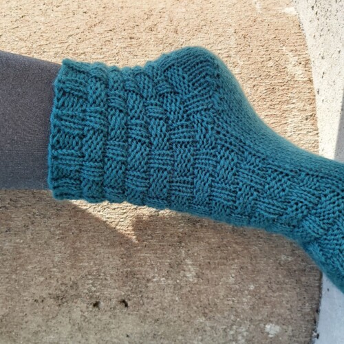 En bild på en stickad socka